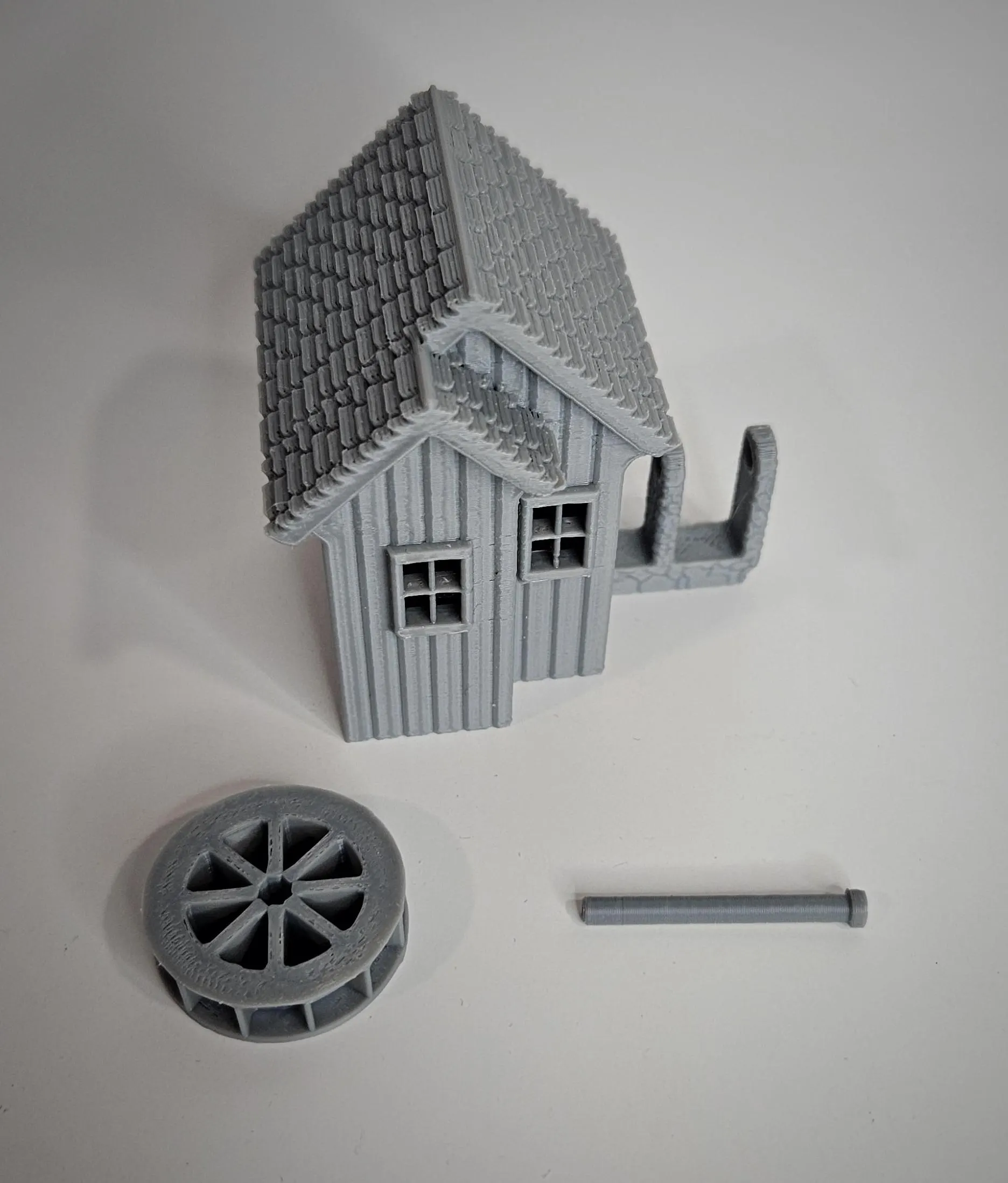 Painted example of HO scale waterwheel with medium building